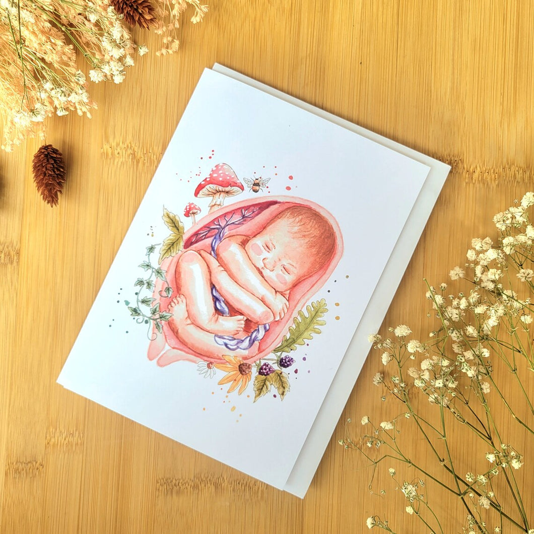 Carte de Souhait bébé en siège à l'aquarelle imprimé au Québec par La Doula